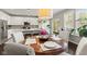 Dining area offers natural light, kitchen access, and stylish pendant lighting at 9014 Ramapo Dr, Fishers, IN 46038