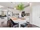 Kitchen features white cabinets, stainless steel appliances, large island with seating, and pendant lighting at 9014 Ramapo Dr, Fishers, IN 46038