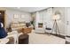 Comfortable living room featuring a plush sofa, stylish decor, and abundant natural light from the window at 9014 Ramapo Dr, Fishers, IN 46038