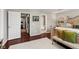 Bright main bedroom featuring hardwood floors and multiple doorways to other rooms at 9014 Ramapo Dr, Fishers, IN 46038
