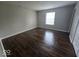 A spacious bedroom featuring beautiful flooring and a bright window, perfect for a peaceful retreat at 9118 Lansburgh Ct, Indianapolis, IN 46234