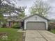 Charming single-story home with a brick facade, grey siding, and a well-manicured lawn at 9118 Lansburgh Ct, Indianapolis, IN 46234