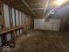 Spacious unfinished two car garage with a workbench, perfect for storage or projects at 9118 Lansburgh Ct, Indianapolis, IN 46234