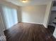 Bright living area with wood-look floors and large windows offering plenty of natural light at 9118 Lansburgh Ct, Indianapolis, IN 46234