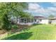 Exterior view of home featuring backyard and screened-in porch at 1021 N Bolton Ave, Indianapolis, IN 46219