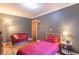 Comfortable bedroom with soft lighting, featuring a cozy bed and a stylish reading corner at 1021 N Bolton Ave, Indianapolis, IN 46219