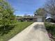 Attractive ranch home boasting a long driveway and well-manicured front lawn at 1021 N Bolton Ave, Indianapolis, IN 46219