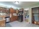 Well-lit kitchen featuring stainless steel appliances, wooden cabinetry, and stylish backsplash at 1021 N Bolton Ave, Indianapolis, IN 46219