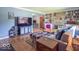 Cozy living room featuring a stone fireplace, built-in bookshelves, and comfortable seating arrangement at 1021 N Bolton Ave, Indianapolis, IN 46219