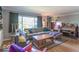 Bright living room boasting hardwood floors, large window, and comfortable seating arrangement at 1021 N Bolton Ave, Indianapolis, IN 46219