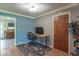 Bright home office with a wooden desk and a patterned rug, creating an ideal workspace at 1021 N Bolton Ave, Indianapolis, IN 46219