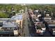 Aerial view showcasing the community's street, sidewalks, and landscaping on a sunny day at 11 Woodacre Dr, Carmel, IN 46032