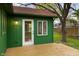 Close up view of a wooden deck in the backyard of a green home, showcasing outdoor living at 11 Woodacre Dr, Carmel, IN 46032