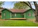 Backyard view of the home with a wooden deck and well-maintained lawn at 11 Woodacre Dr, Carmel, IN 46032