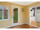 Inviting space with a back door, window to the yard, and natural light at 11 Woodacre Dr, Carmel, IN 46032