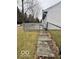 This backyard features a wooden deck with stairs that lead down to the lawn at 1102 Branifield Ct, Franklin, IN 46131