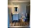 Well-lit bathroom featuring a vanity, toilet, and glass-door shower at 1102 Branifield Ct, Franklin, IN 46131
