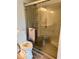 Accessible bathroom including toilet, roll-in shower, and vanity with grab bars at 1102 Branifield Ct, Franklin, IN 46131