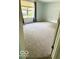 Neutral bedroom featuring neutral carpeting and a large window providing natural light at 1102 Branifield Ct, Franklin, IN 46131