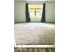 Bright bedroom featuring neutral carpeting and a large window providing natural light at 1102 Branifield Ct, Franklin, IN 46131