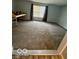 Bedroom featuring plush carpeting and a sunlit window with blinds at 1102 Branifield Ct, Franklin, IN 46131
