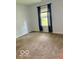 Bedroom featuring plush carpeting and a sunlit window with blinds at 1102 Branifield Ct, Franklin, IN 46131