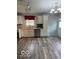 Well-lit kitchen with stainless steel appliances, light wood floors and cabinetry, and modern fixtures at 1102 Branifield Ct, Franklin, IN 46131