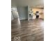 Modern kitchen with stainless steel appliances, white cabinets, and a decorative backsplash at 1102 Branifield Ct, Franklin, IN 46131