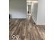 Spacious living room featuring wood floors and neutral color scheme at 1102 Branifield Ct, Franklin, IN 46131