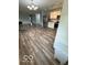Spacious living room with hardwood floors and seamless access to the kitchen at 1102 Branifield Ct, Franklin, IN 46131