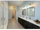 Spacious bathroom with double vanity, tiled floors, and a glass shower in a home at 1115 Freshwater Ln, Cicero, IN 46034