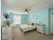 Light-filled bedroom with cool walls and two windows with white curtains at 1115 Freshwater Ln, Cicero, IN 46034