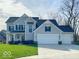 Charming two-story home with a well-manicured lawn and attached three car garage at 1115 Freshwater Ln, Cicero, IN 46034