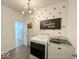 Charming laundry room with polka dot decor, laundry machines and quirky decor at 1115 Freshwater Ln, Cicero, IN 46034