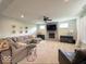 Comfortable living room with stone fireplace, plush seating, and ample natural light at 1115 Freshwater Ln, Cicero, IN 46034