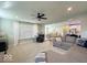 Comfortable living room area with plush gray sofa, carpeting, and natural light at 1115 Freshwater Ln, Cicero, IN 46034