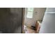 Bathroom with a walk-in shower, vanity and a window for natural light at 1126 Kings Ct, Indianapolis, IN 46260