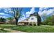 Charming two-story home featuring a well-maintained lawn and blooming flowers at 1126 Kings Ct, Indianapolis, IN 46260