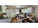 Kitchen featuring white cabinets and countertops, needing significant attention at 1126 Kings Ct, Indianapolis, IN 46260