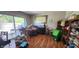 View of an untidy Living room with a sliding glass door to the backyard at 1126 Kings Ct, Indianapolis, IN 46260