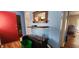 Living room features an aquarium and hardwood floors needing TLC at 1126 Kings Ct, Indianapolis, IN 46260
