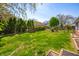 Spacious backyard with well-maintained lawn, mature trees, and privacy fence at 1127 Alydar Cir, Indianapolis, IN 46217