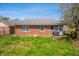 Well-maintained brick home featuring a lush green backyard, patio and space for outdoor entertaining at 1127 Alydar Cir, Indianapolis, IN 46217
