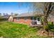 Well-maintained brick home featuring a lush green backyard with a patio and space for outdoor entertaining at 1127 Alydar Cir, Indianapolis, IN 46217
