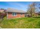 Well-maintained brick home featuring a lush green backyard, and space for outdoor entertaining at 1127 Alydar Cir, Indianapolis, IN 46217
