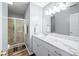 Well-lit bathroom with a modern vanity, decorative lighting, and glass-enclosed shower at 1127 Alydar Cir, Indianapolis, IN 46217