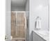 Bathroom with a glass shower, marble countertop vanity, and neutral walls at 1127 Alydar Cir, Indianapolis, IN 46217
