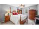 Bright bedroom with hardwood furniture, fan, and neutral walls at 1127 Alydar Cir, Indianapolis, IN 46217
