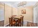 Bright dining room features hardwood flooring, natural light, and modern light fixture at 1127 Alydar Cir, Indianapolis, IN 46217