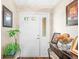 Welcoming front foyer with a white door, plant stand, and decorative table at 1127 Alydar Cir, Indianapolis, IN 46217